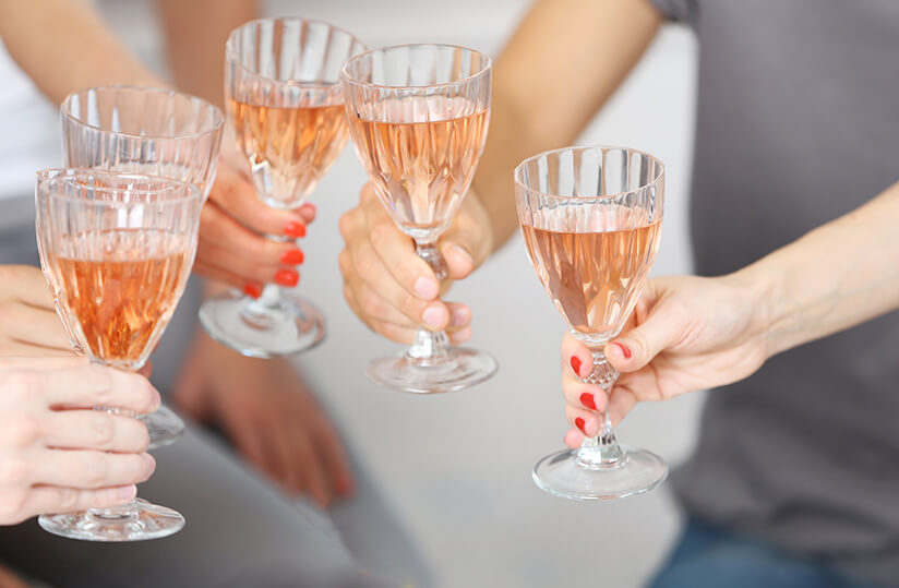 friends-hands-glasses-pink-wine